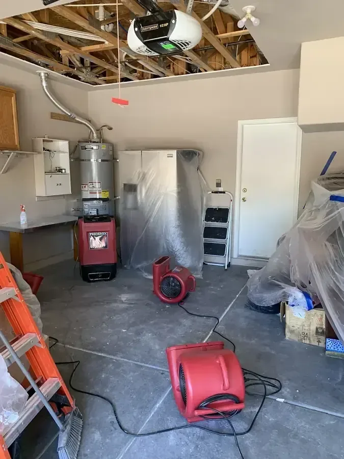 Drying machines beneath an opened garage ceiling