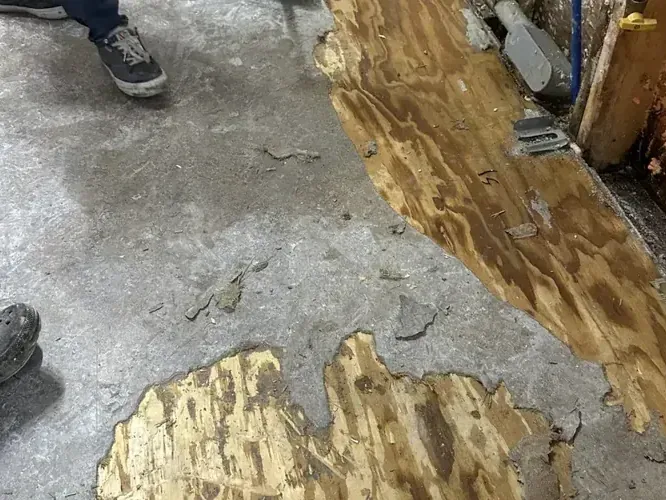 Floor covering removed to expose the concrete substrate beneath